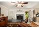 Cozy living room features a fireplace, and a doorway leading to the back porch at 4715 Howard Dr, Powder Springs, GA 30127