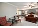 The main bedroom features a sitting area and four post bed with comfortable seating and ceiling fan at 4715 Howard Dr, Powder Springs, GA 30127