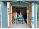 Interior view of shed showing lawn equipment and storage at 4715 Howard Dr, Powder Springs, GA 30127
