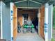 Shed's interior with lawnmower and other tools, maximizing storage space and functionality at 4715 Howard Dr, Powder Springs, GA 30127