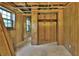 Unfinished basement area showing walls with wood paneling, closet, and windows at 1512 Pine Cir, Lawrenceville, GA 30044