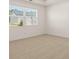 Bedroom with a large window and soft, neutral carpeting at 1624 Palladian Way, Lithonia, GA 30058