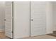 Cozy bedroom with modern door features, neutral decor, and clean white walls at 1624 Palladian Way, Lithonia, GA 30058