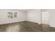 Bright bedroom with a large window and luxury vinyl plank flooring at 1624 Palladian Way, Lithonia, GA 30058
