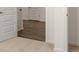 Hallway with modern doors, light-colored carpet, and a glimpse of wood flooring at 1624 Palladian Way, Lithonia, GA 30058