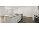 Modern kitchen island offers a stainless steel sink, dishwasher, and granite countertops at 1624 Palladian Way, Lithonia, GA 30058