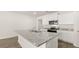 Close up of the beautiful island featuring granite countertops and a stainless steel sink at 1624 Palladian Way, Lithonia, GA 30058
