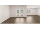 Spacious living room features sliding glass doors and luxury vinyl plank flooring at 1624 Palladian Way, Lithonia, GA 30058