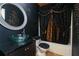 Vanity with a black countertop, glass sink, and a decorative mirror at 1640 Donovans Nw Rdg, Kennesaw, GA 30152