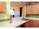 Well-lit kitchen area with stylish countertops, stainless steel sink, and a convenient breakfast bar for casual dining at 1640 Donovans Nw Rdg, Kennesaw, GA 30152