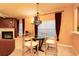 Bright living room with a fireplace, chandelier, and large windows at 1640 Donovans Nw Rdg, Kennesaw, GA 30152