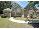 Charming two-story home with a manicured lawn, inviting entrance, and lush landscaping, creating an attractive curb appeal at 375 Beracah Sw Trl, Atlanta, GA 30331