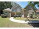 Charming two-story brick home with manicured lawn and inviting walkway, offers a warm and welcoming curb appeal at 375 Beracah Tr Southwest Sw Trl, Atlanta, GA 30331