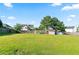 Lush backyard featuring a storage shed, green grass, and partial wooden fence at 2837 Lakewater Way, Snellville, GA 30039