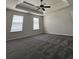 Large bedroom features recessed ceiling and ceiling fan at 2837 Lakewater Way, Snellville, GA 30039