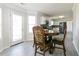 Dining area adjacent to kitchen featuring backyard access, a round table, and views of kitchen appliances at 2837 Lakewater Way, Snellville, GA 30039