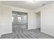 Open-concept dining room offering new carpet, classic wainscoting, and access to other rooms at 2837 Lakewater Way, Snellville, GA 30039