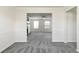 Classic dining room with new carpet, wide entry to living room, and simple lighting at 2837 Lakewater Way, Snellville, GA 30039