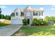 Charming two-story home with a well-manicured lawn, two-car garage, and a brick facade at 2837 Lakewater Way, Snellville, GA 30039