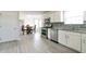Bright eat-in kitchen with stainless steel appliances, granite countertops, and wood-look tile flooring at 2837 Lakewater Way, Snellville, GA 30039