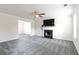 Spacious living room featuring fireplace, new carpet, ceiling fan and abundant natural light at 2837 Lakewater Way, Snellville, GA 30039