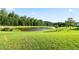 Scenic view of a beautiful pond, surrounded by lush greenery and trees, creating a tranquil environment at 2837 Lakewater Way, Snellville, GA 30039
