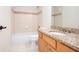 Bathroom features granite counters, tile accents, and a tiled shower-tub combination at 3333 N Hembree Rd, Marietta, GA 30062