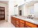 Bathroom vanity with double sinks, granite counters, with walk-in closet access at 3333 N Hembree Rd, Marietta, GA 30062