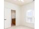 Bedroom with light carpet and a glimpse of the bathroom and vanity through an open door at 3333 N Hembree Rd, Marietta, GA 30062