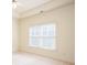 Bedroom with a large window that provides natural lighting and neutral colored walls at 3333 N Hembree Rd, Marietta, GA 30062