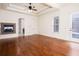 Spacious bedroom boasting hardwood floors, tray ceilings, and a cozy fireplace at 3333 N Hembree Rd, Marietta, GA 30062