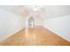 Large bonus room with vaulted ceilings, wood-look tile flooring, and bright neutral paint at 3333 N Hembree Rd, Marietta, GA 30062