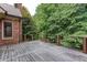 Spacious wood deck with metal railing provides space for outdoor seating and entertaining at 3333 N Hembree Rd, Marietta, GA 30062