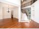 Bright foyer with staircase, dark hardwood floors, and chandelier at 3333 N Hembree Rd, Marietta, GA 30062