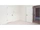Hallway with carpeted floor and two doors open to a bathroom and another room at 3333 N Hembree Rd, Marietta, GA 30062