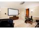 Home theater featuring projector screen, comfortable seating, and media storage at 3333 N Hembree Rd, Marietta, GA 30062