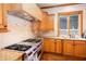 Gourmet kitchen featuring professional-grade appliances, granite countertops, and custom cabinetry at 3333 N Hembree Rd, Marietta, GA 30062