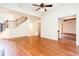 Bright and airy living room featuring hardwood floors and staircase with decorative iron railings at 3333 N Hembree Rd, Marietta, GA 30062