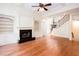 Elegant living room with a fireplace, built-in shelves, and hardwood floors at 3333 N Hembree Rd, Marietta, GA 30062
