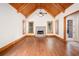 Vaulted ceiling and stone fireplace in a spacious living area with hardwood floors and natural light at 3333 N Hembree Rd, Marietta, GA 30062