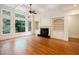 Bright living room features a fireplace, built-in shelves, and large windows at 3333 N Hembree Rd, Marietta, GA 30062