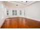 Spacious main bedroom with natural light, hardwood floors, and a tray ceiling at 3333 N Hembree Rd, Marietta, GA 30062