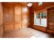 Office boasts rich wood paneling, built-in bookshelves, and a cozy window seat at 3333 N Hembree Rd, Marietta, GA 30062