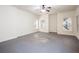 Spacious room featuring neutral paint, large windows, and a ceiling fan for added comfort at 3333 N Hembree Rd, Marietta, GA 30062