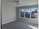 Bright, carpeted bedroom with a large window offering a scenic view at 3352 Cranston Ln, Kennesaw, GA 30144