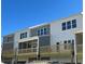 Exterior view of gray and white townhomes with private decks and ample natural light at 3352 Cranston Ln, Kennesaw, GA 30144