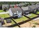 Aerial view of fenced backyard with fire pit, patio, trampoline in a desirable community at 4171 Towncastle Ln, Buford, GA 30518