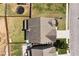 Aerial view of the backyard featuring a fire pit, trampoline, and outdoor patio area at 4171 Towncastle Ln, Buford, GA 30518