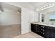 The main bath has a granite countertop, dark cabinets, double sinks, and access to the main bedroom at 4171 Towncastle Ln, Buford, GA 30518