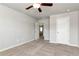 The carpeted bedroom offers lots of space and natural light with easy access to other areas of the home at 4171 Towncastle Ln, Buford, GA 30518